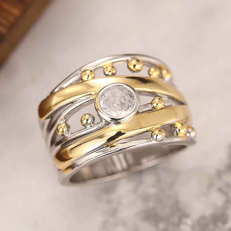 AuroraTwist™ – Anello Elegante Bicolore con Cristallo