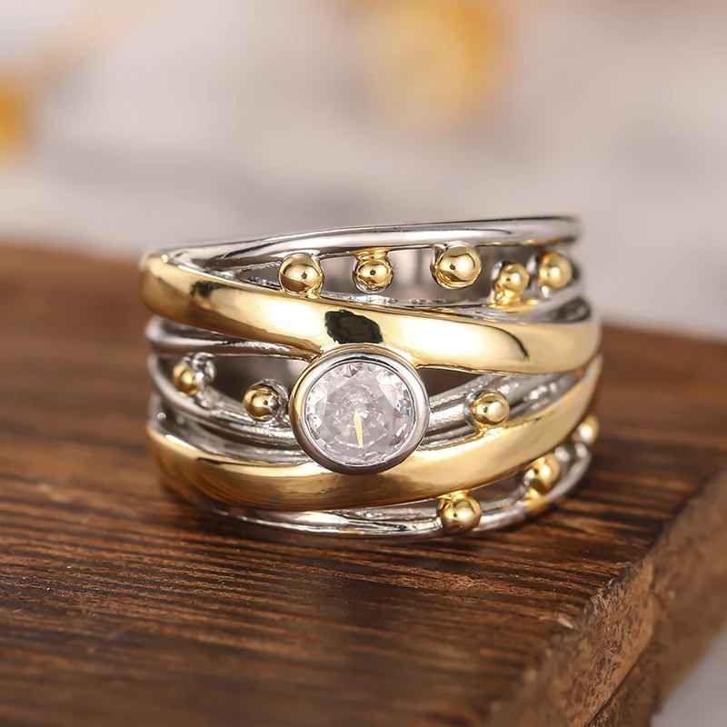 AuroraTwist™ – Anello Elegante Bicolore con Cristallo